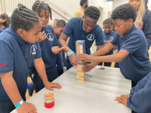 HU-MS² scholars working together to build a tower in a hands-on challenge